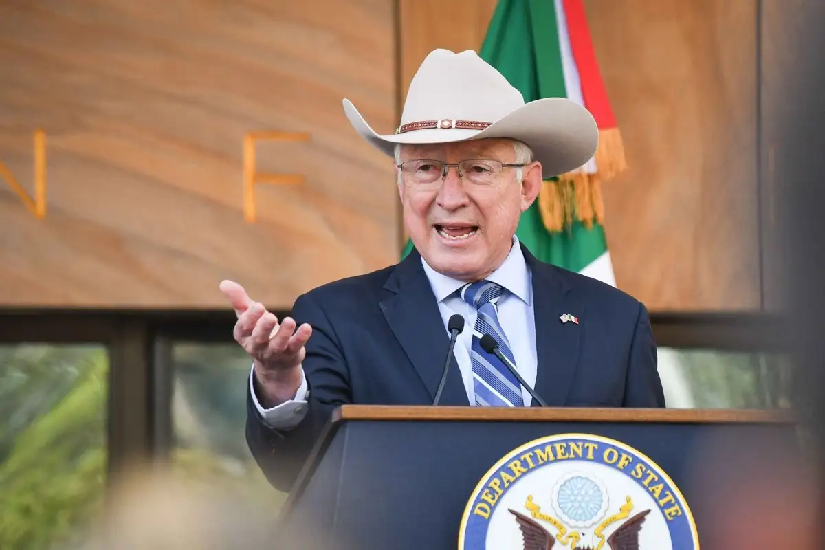 Former US ambassador to Mexico Ken Salazar speaking at a State Department podium