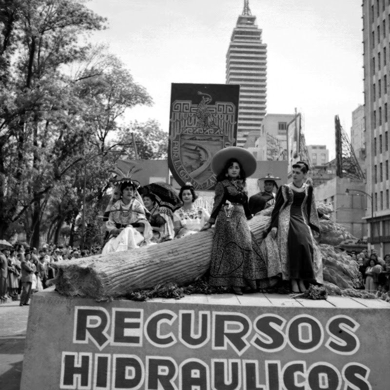 Young women in regional costumes on a Secretariat of Hydraulic Resources parade float, Mexico City, circa 1950
