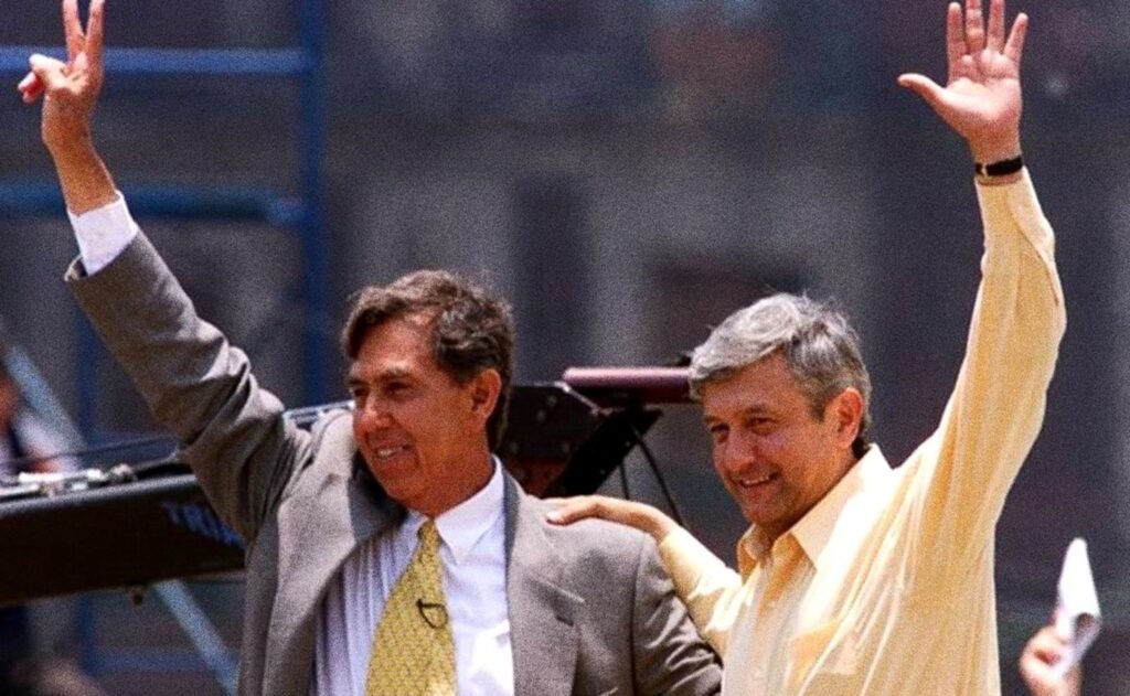 Cuauhtémoc Cárdenas and Andrés Manuel López Obrador raise their arms to the crowd at a rally