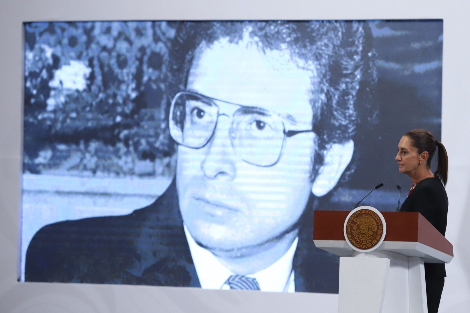 Archival image of Ernesto Zedillo projected on a screen as President Claudia Sheinbaum speaks at the morning press conference