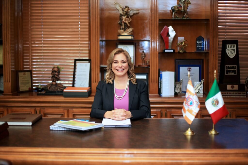 Chihuahua Governor Maru Campos smiling at her desk