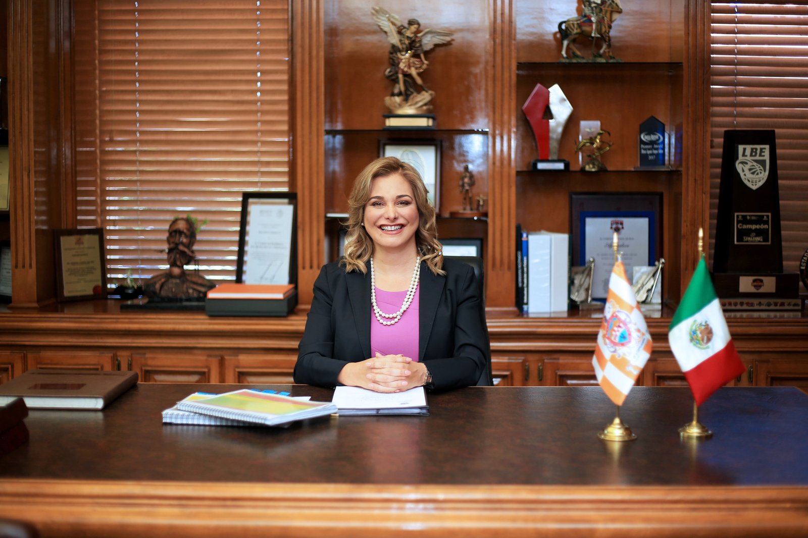 Chihuahua Governor Maru Campos smiling at her desk